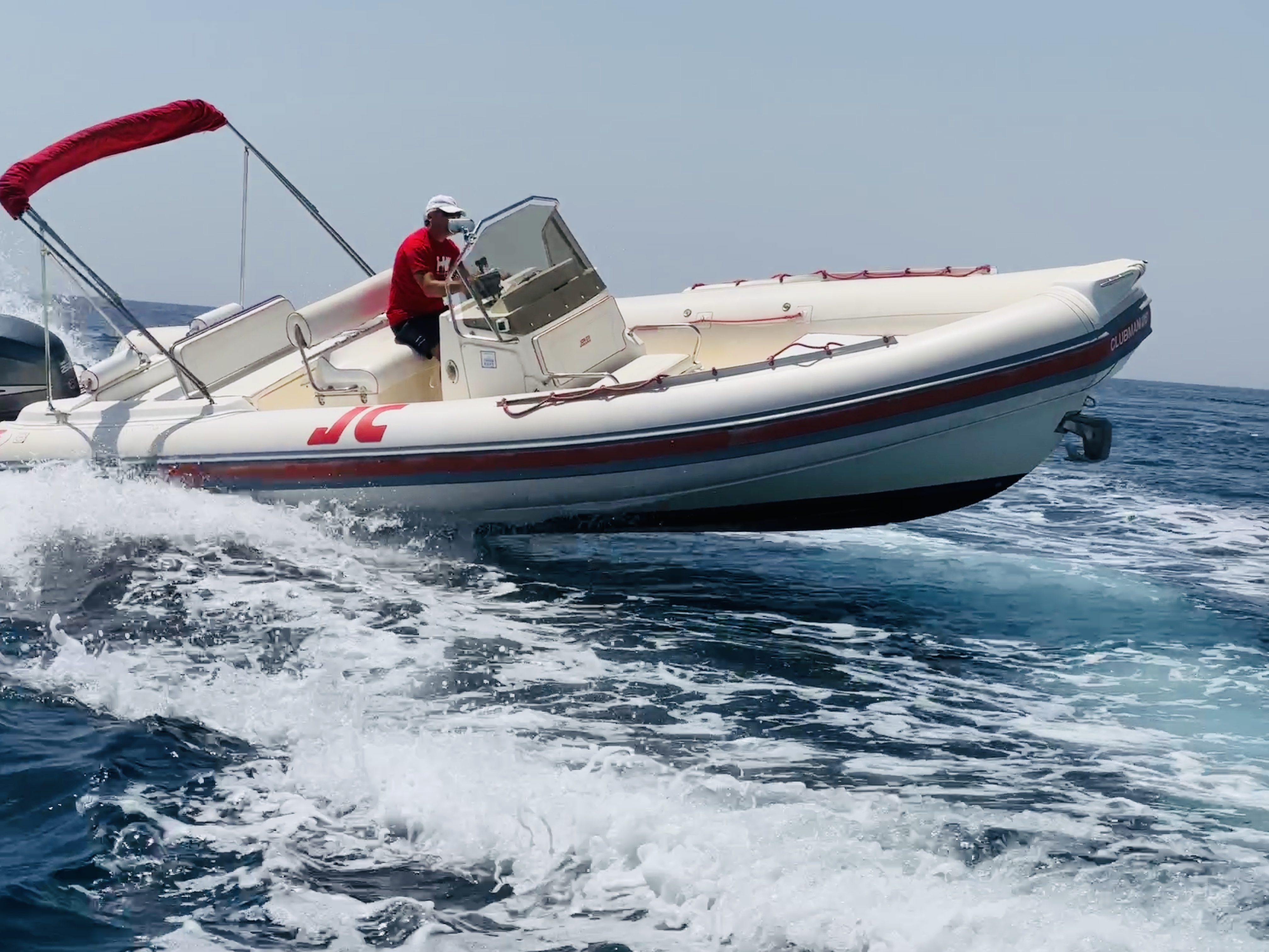 Captain Alessandro at the helm of the Mare con Ale Joker boat off Siracusa
